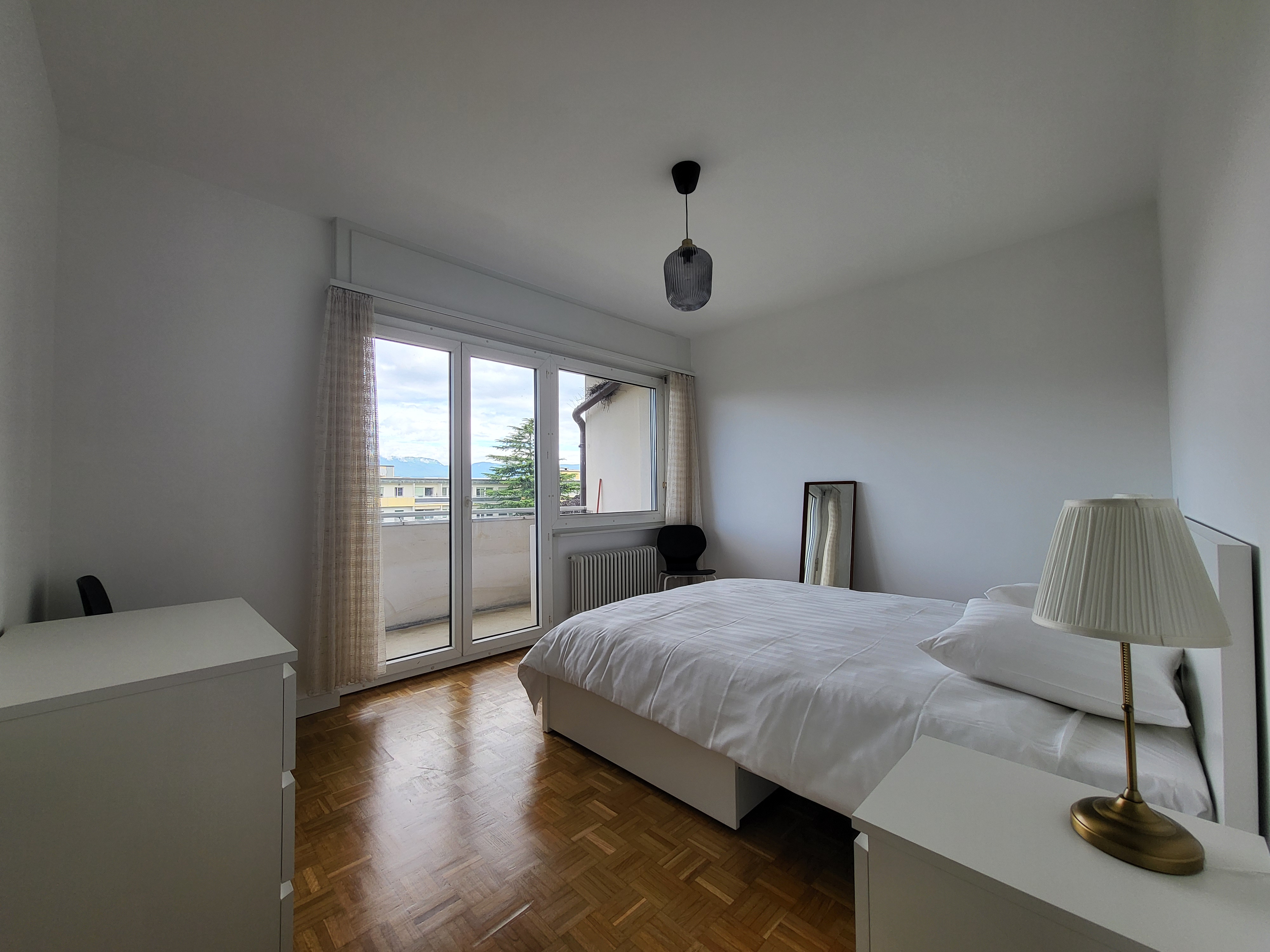 Image of the apartment's bedroom, with its new cosy furniture