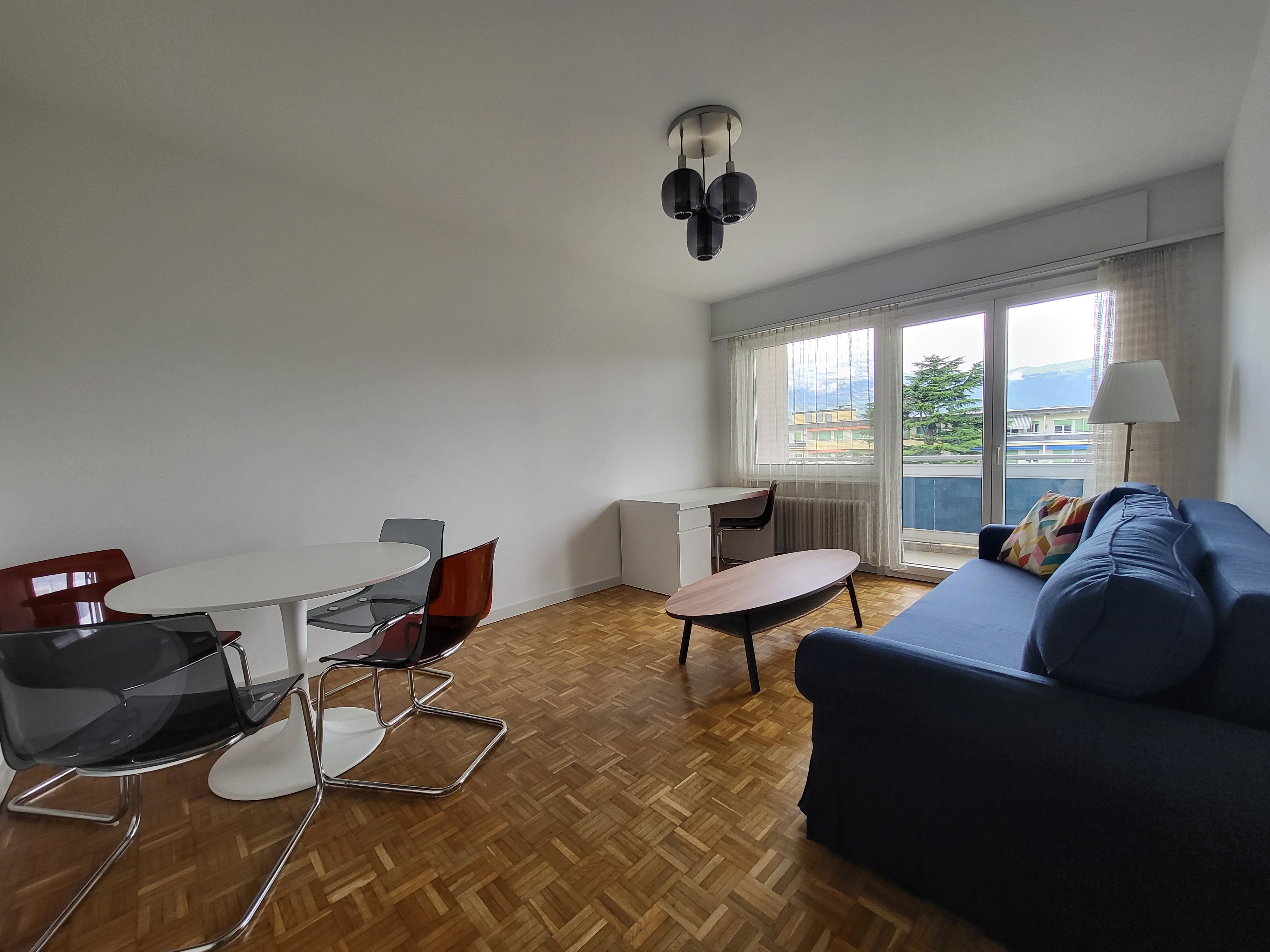 Image of the apartment's living room, with its new cosy furniture